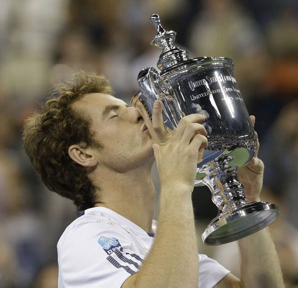 Britain's Andy Murray poses with the trophy after beating Serbia's Novak Djokovic in the championship match at the 2012 US Open tennis tournament.