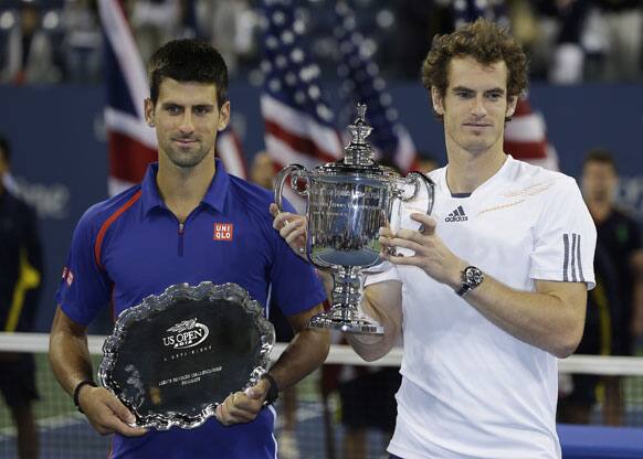 Britain's Andy Murray poses with Serbia's Novak Djokovic after the championship match at the 2012 US Open tennis tournament.