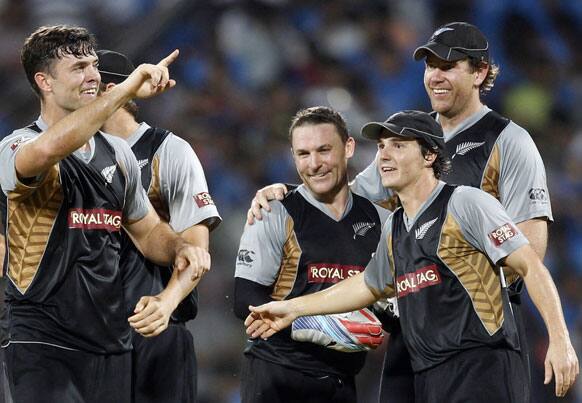 New Zealand cricketers celebrate after winning the Twenty20 international cricket match against India in Chennai.