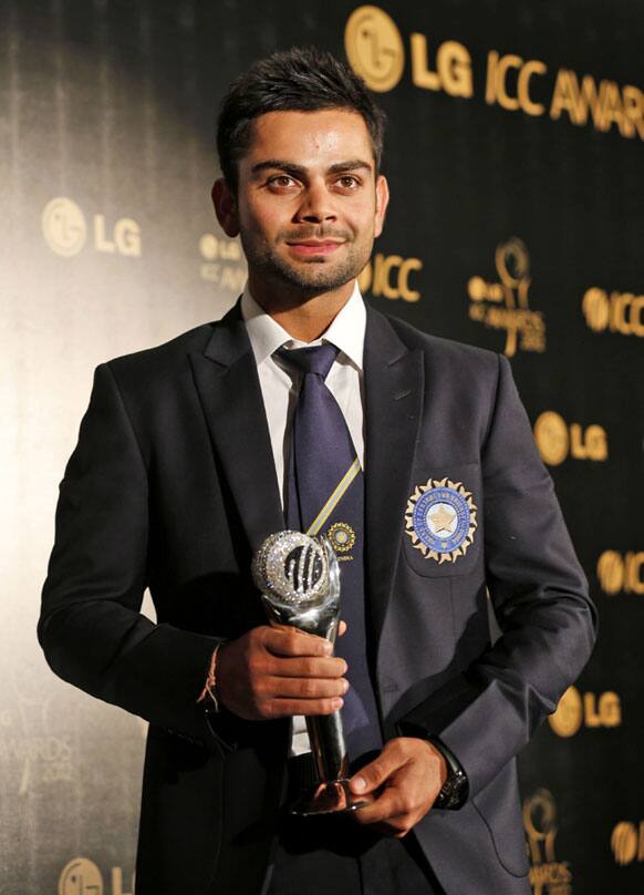 Indian cricketer Virat Kholi poses with the ICC Men's ODI Cricketer of the Year award at the ICC Awards 2012 in Colombo.