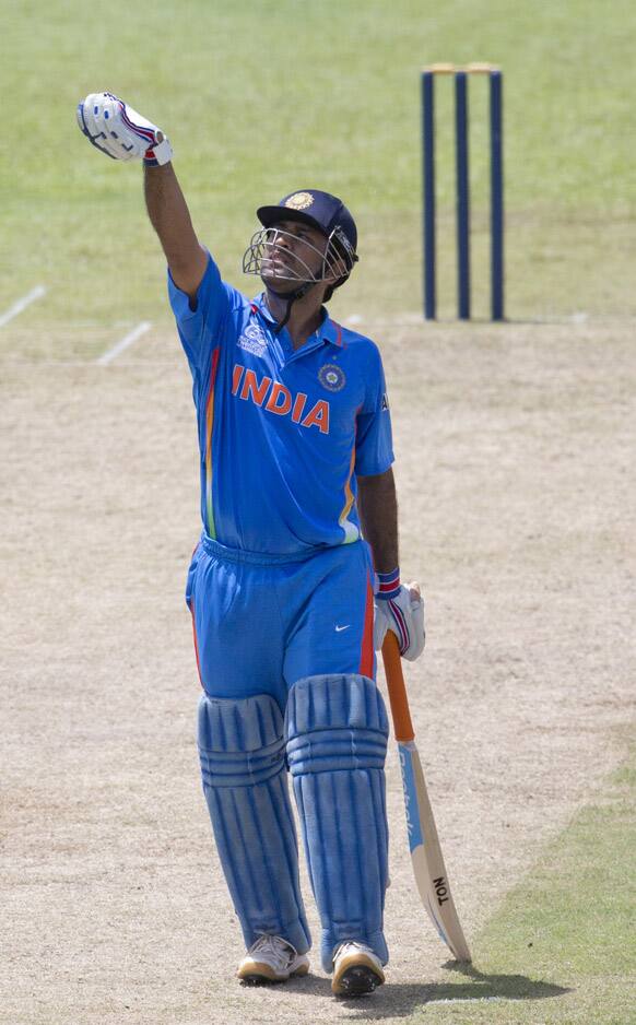 Mahendra Singh Dhoni gestures after hitting a boundary during a practice match between Sri Lanka and India ahead of the ICC T20 cricket World Cup in Colombo, Sri Lanka.