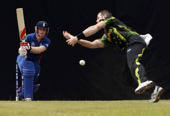 Australia's bowler Daniel Christian, right, unsuccessfully attempts to catch a ball to dismiss England's batsman Eoin Morgan during their warm-up game ahead of the ICC Twenty20 Cricket World Cup in Colombo.