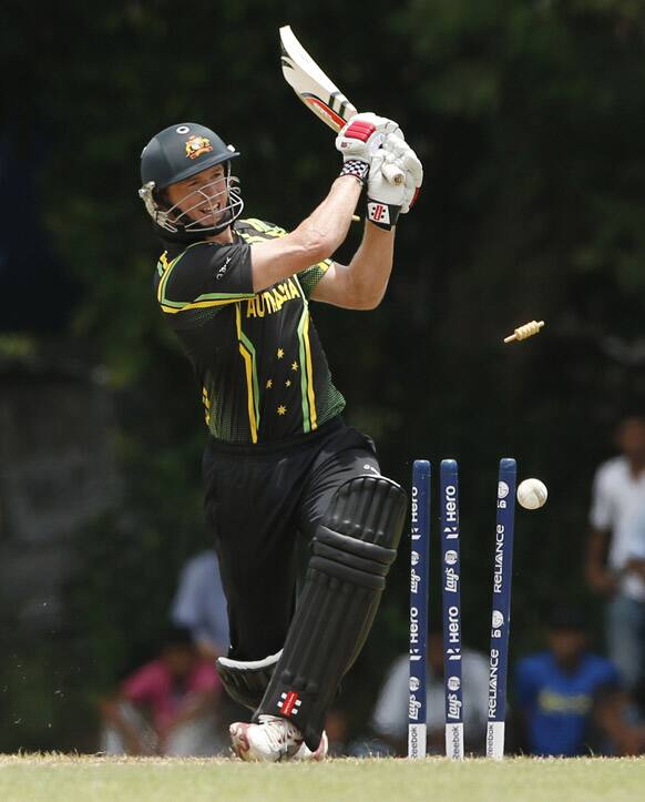 Bails fly off from the wicket of Australia's T20 cricket captain George Bailey during their warm up game against England in Colombo, Sri Lanka.