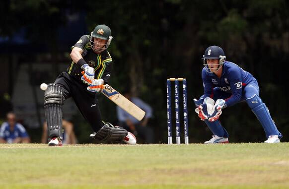 Australia's Michael Hussey plays a shot in front of England's wicketkeeper Craig Kieswetter, right, during their warm-up match ahead of the ICC Twenty20 Cricket World Cup in Colombo.