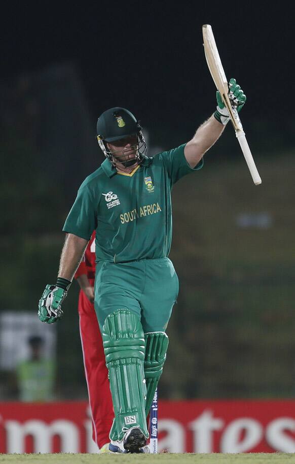 South Africa's Richard Levi celebrates as he reaches a half-century during the ICC Twenty20 Cricket World Cup match between South Africa and Zimbabwe in Hambantota.