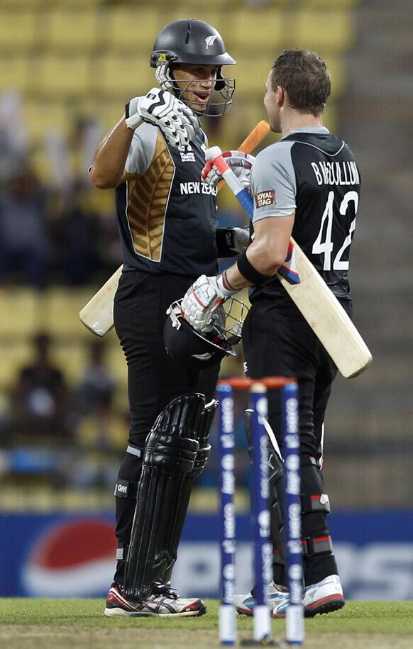 New Zealand captain Ross Taylor greets teammate Brendon McCullum on scoring a century during the ICC Twenty20 Cricket World Cup match against Bangladesh in Pallekele, Sri Lanka.