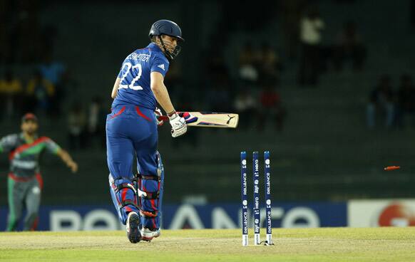 England's batsman Craig Kieswetter looks back at his stumps after being bowled out by Afghanistan's Shapoor Zadran, unseen, during their match in the ICC Twenty20 Cricket World Cup in Colombo, Sri Lanka.