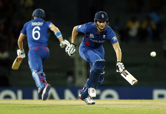 England's batsmen Alex Hales, right, and Luke Wright run between wickets during their match against Afghanistan in the ICC Twenty20 Cricket World Cup in Colombo, Sri Lanka.