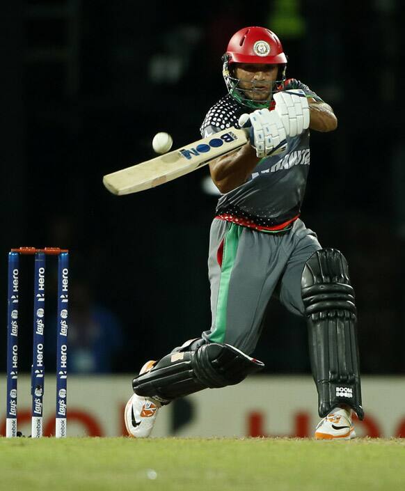 Afghanistan's Gulbodin Naib plays a shot during their ICC Twenty20 Cricket World Cup match against Afghanista in Colombo, Sri Lanka.