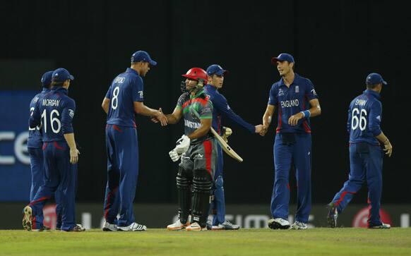 Stuart Broad, shakes hands with Afghanistan's Gulbodin Naib after defeating them by 116 runs in their ICC Twenty20 Cricket World Cup match against Afghanista in Colombo.