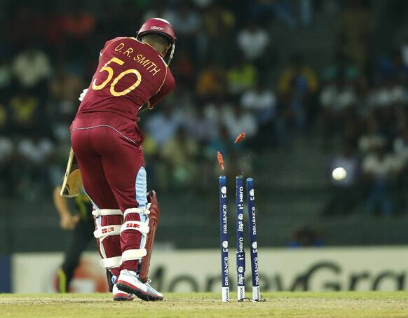 West Indies' batsman Dwayne Smith is bowled out by Australia's Mitchell Starc during their ICC Twenty20 Cricket World Cup match in Colombo, Sri Lanka.