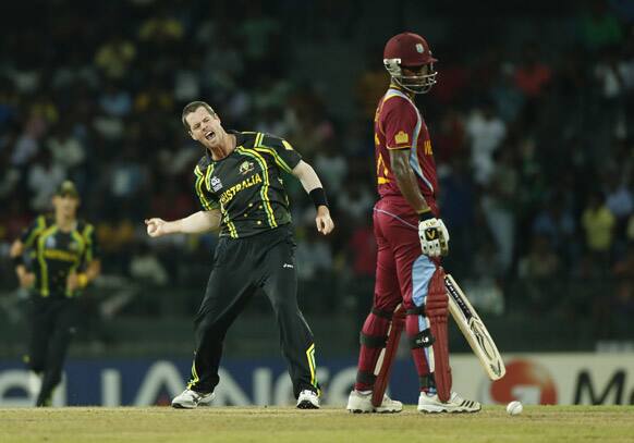 Australia bowler Daniel Christian, left, celebrates the dismissal of West Indies' batsman Johnson Charles during their ICC Twenty20 Cricket World Cup match in Colombo, Sri Lanka.