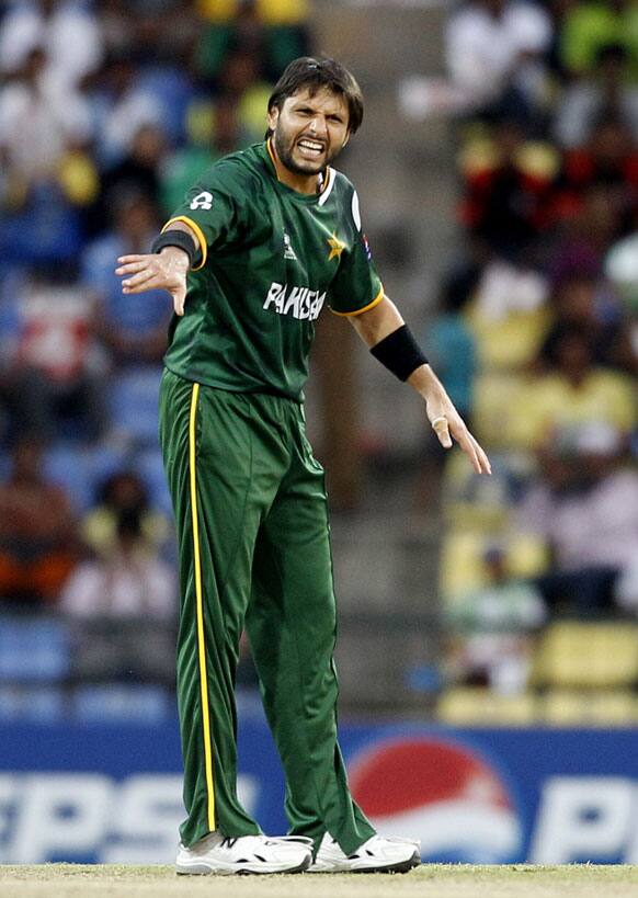 Pakistan's bowler Shahid Afridi reacts after bowling a delivery during the ICC Twenty20 Cricket World Cup match against New Zealand in Pallekele.