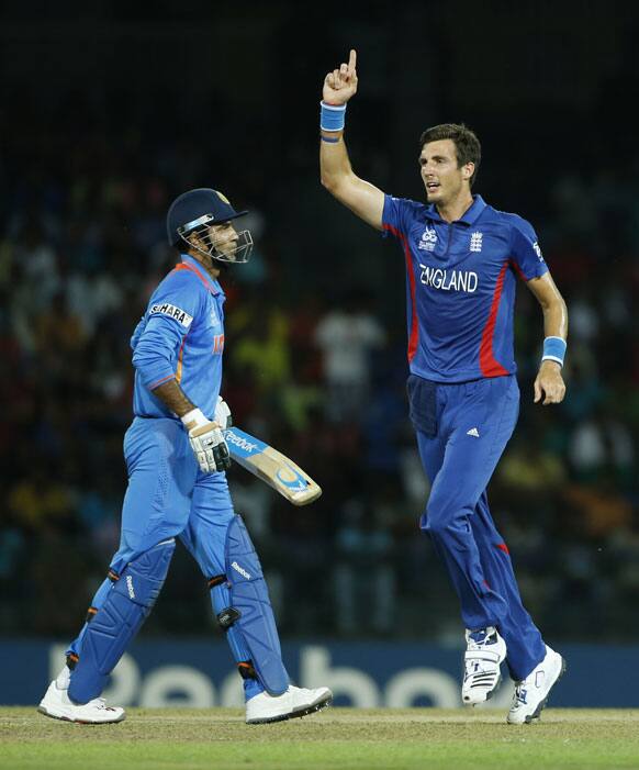 England's bowler Steven Finn, right, celebrates the wicket of India's Irfan Pathan during an ICC Twenty20 Cricket World Cup match in Colombo, Sri Lanka.