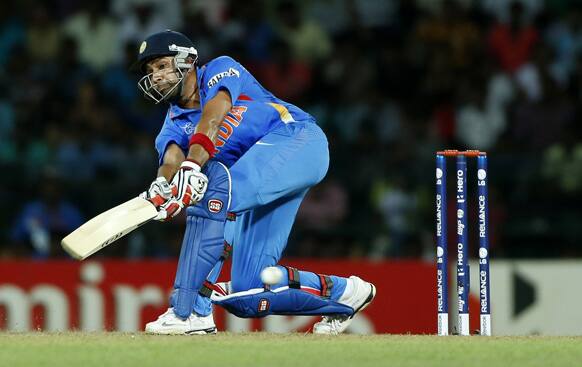 India's batsman Rohit Sharma plays a shot during an ICC Twenty20 Cricket World Cup match against England in Colombo.