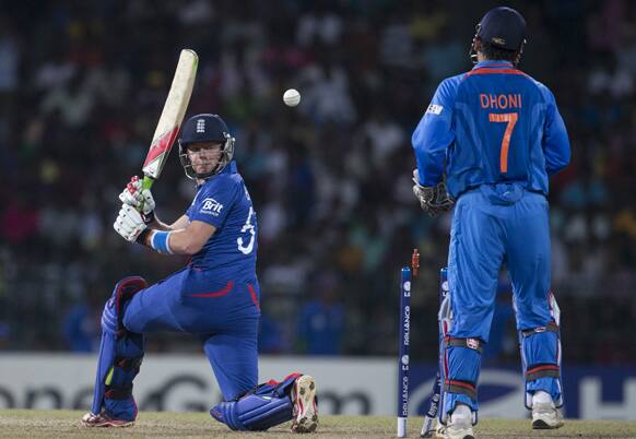 England's Jonny Bairstow, left, loses his wicket as India's captain Mahendra Singh Dhoni, right, looks on during a ICC Twenty20 Cricket World Cup match between England and India in Colombo.