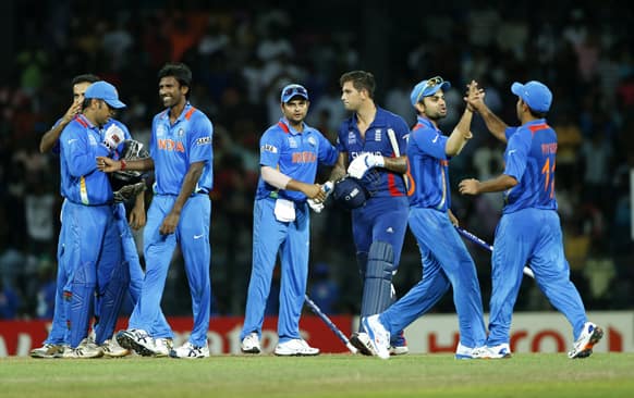 Indian team members celebrate their team's victory over England in an ICC Twenty20 Cricket World Cup match in Colombo.