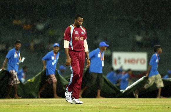 West Indies' cricketer Kieron Pollard leaves the field as rain interrupted play during an ICC Twenty20 Cricket World Cup match against Ireland in Colombo.