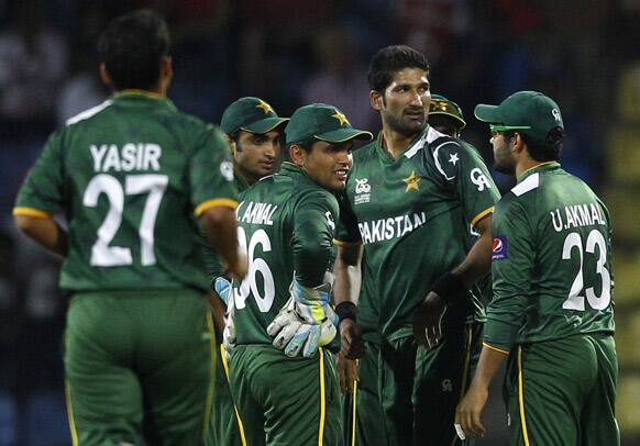 Pakistan's bowler Sohail Tanvir, second right, celebrates with teammates after taking the wicket of Bangladesh batsman Mohammad Ashraful, not seen, during the ICC Twenty20 Cricket World Cup match in Pallekele, Sri Lanka.