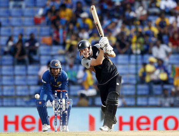 Sri Lanka's wicketkeeper Kumar Sangakkara, left, watches New Zealand's batsman Rob Nicol, play a shot during the ICC Twenty20 Cricket World Cup Super Eight match in Pallekele, Sri Lanka.