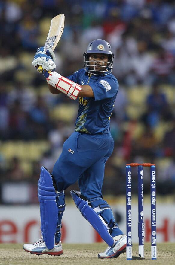 Sri Lanka's batsman Tillakaratne Dilshan watches his shot during the ICC Twenty20 Cricket World Cup Super Eight match against New Zealand in Pallekele, Sri Lanka.