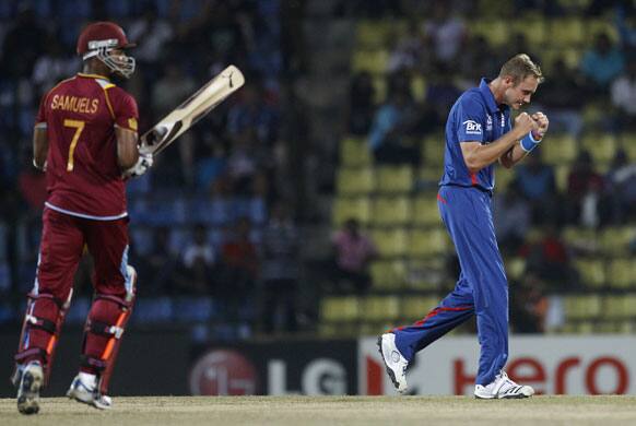 England's captain Stuart Broad reacts after taking the wicket of West Indies' batsman Marion Samuels, left, during the ICC Twenty20 Cricket World Cup Super Eight match in Pallekele.