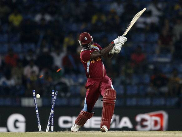 West Indies' captain Darren Sammy is bowled out by England's captain Stuart Broad, not seen, during the ICC Twenty20 Cricket World Cup Super Eight match in Pallekele, Sri Lanka.