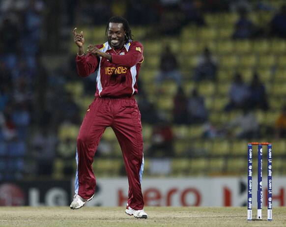 West Indies' bowler Chris Gayle dances after taking the wicket of England's batsman Jonny Bairstow, not seen, during the ICC Twenty20 Cricket World Cup Super Eight match in Pallekele, Sri Lanka.