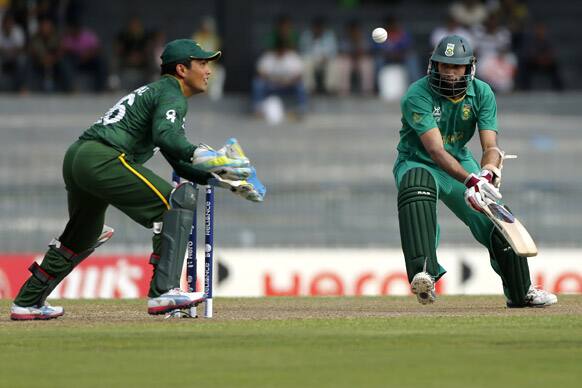 Pakistan's wicketkeeper Kamran Akmal, left, unsuccessfully attempts to take a stumping to dismiss South Africa's batsman Hashim Amla, right, during their ICC Twenty20 Cricket World Cup Super Eight match in Colombo.