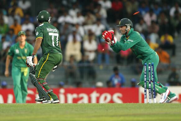 South Africa's wicketkeeper A.B. de Villiers, right, stumps Pakistan's batsman Nasir Jamshed during their ICC Twenty20 Cricket World Cup Super Eight match in Colombo.