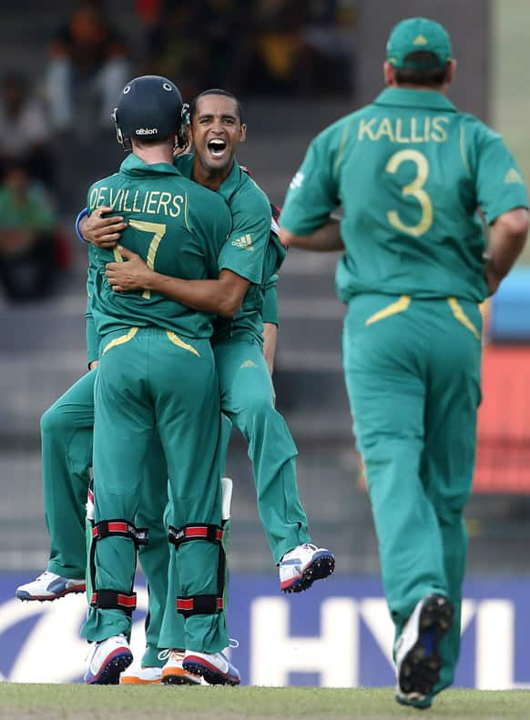 South African bowler Robin Pietersen, center facing the camera, celebrates the dismissal of Pakistan's batsman Nasir Jamshed, unseen, during their ICC Twenty20 Cricket World Cup Super Eight match in Colombo.