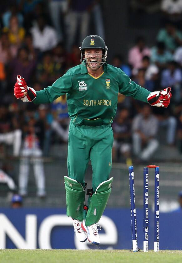 South Africa's captain A.B. de Villiers celebrates the dismissal of Pakistan's batsman Kamran Akmal, unseen, during their ICC Twenty20 Cricket World Cup Super Eight match in Colombo.