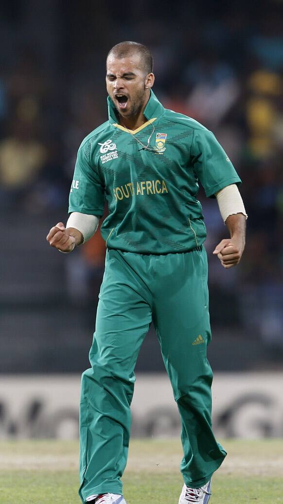 South Africa's bowler Jean-Paul Duminy celebrates the dismissal of Pakistan's batsman Shahid Afridi, unseen, during their ICC Twenty20 Cricket World Cup Super Eight match in Colombo.