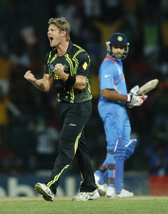 Australia's bowler Shane Watson, left, celebrates the dismissal of India's batsman Irfan Pathan, unseen, as non striker Rohit Sharma looks on during the ICC Twenty20 Cricket World Cup Super Eight match in Colombo.