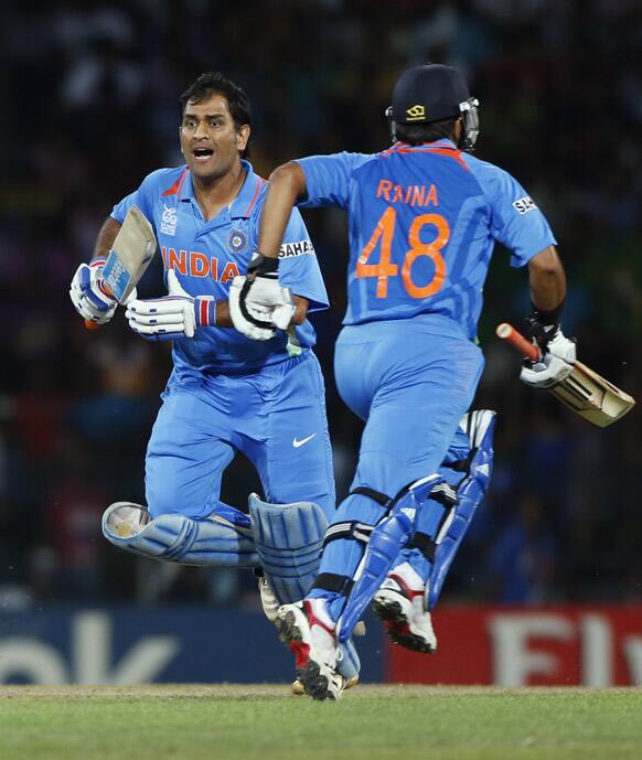 India's batsmen Mahendra Singh Dhoni, and Suresh Raina run between wickets during the ICC Twenty20 Cricket World Cup Super Eight match against Australia in Colombo.