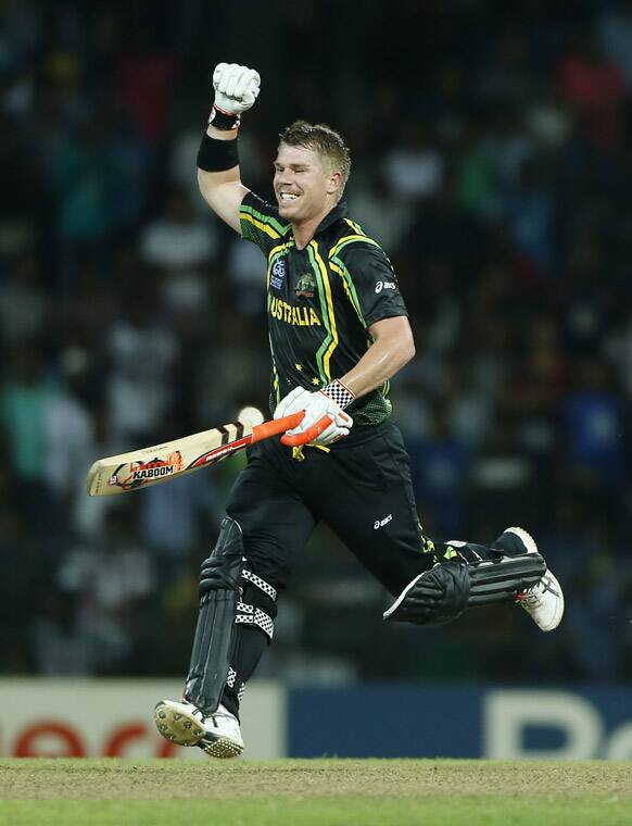 David Warner celebrates his team's victory over India in the ICC Twenty20 Cricket World Cup Super Eight match in Colombo.