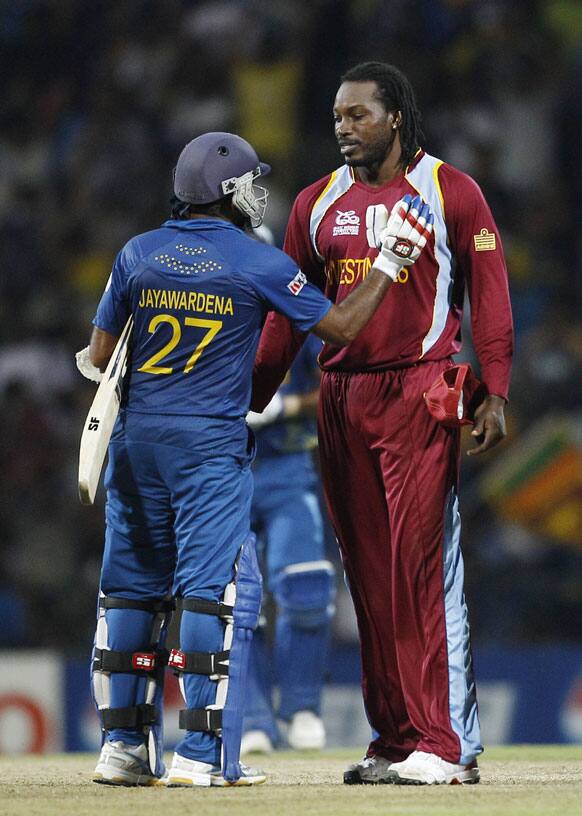 West Indies' cricketer Chris Gayle, greets Sri Lanka's captain Mahela Jayawardene on their win in the ICC Twenty20 Cricket World Cup Super Eight match in Pallekele.