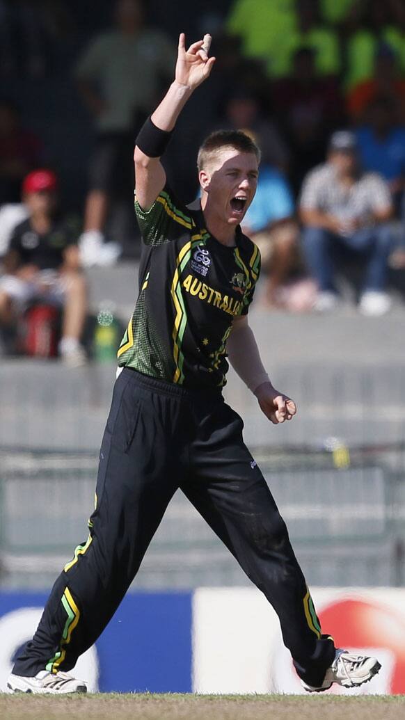 Xavier Doherty celebrates the dismissal of South Africa's batsman Richard Levi, unseen during a ICC Twenty20 Cricket World Cup Super Eight match between South Africa and Australia in Colombo.