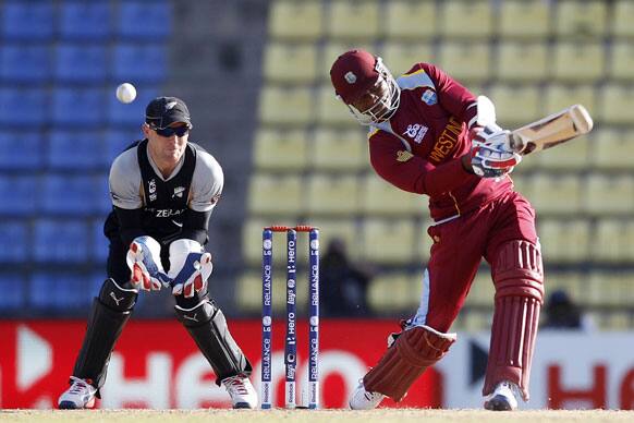 New Zealand's wicketkeeper Brendon McCullum, left, watches West Indies' batsman Marlon Samuels play a shot during their ICC Twenty20 Cricket World Cup Super Eight match in Pallekele.