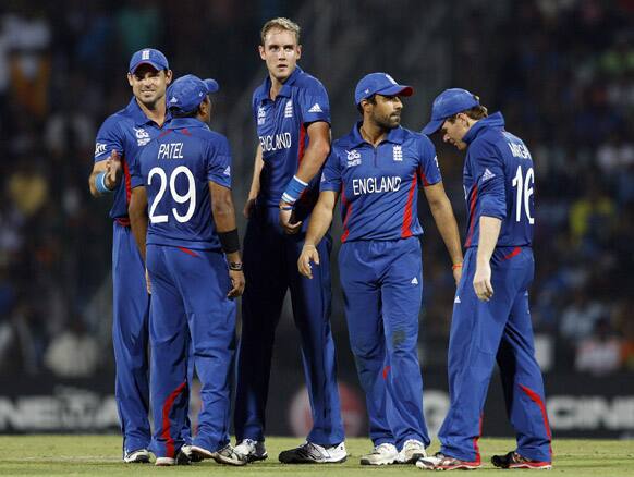 England's captain Stuart Broad, centre, reacts with teammates after taking the wicket of Sri Lanka's batsman Jeevan Mendis, not seen, during the ICC Twenty20 Cricket World Cup Super Eight match in Pallekele.