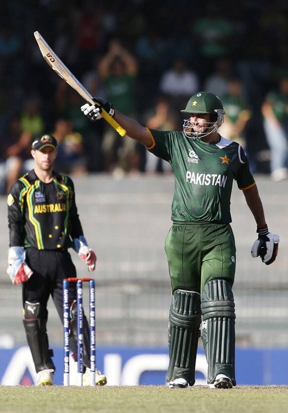 Pakistan's batsman Nasir Jamshed, right, celebrates after scoring a half-century during the ICC Twenty20 Cricket World Cup Super Eight match against Australia in Colombo, Sri Lanka.