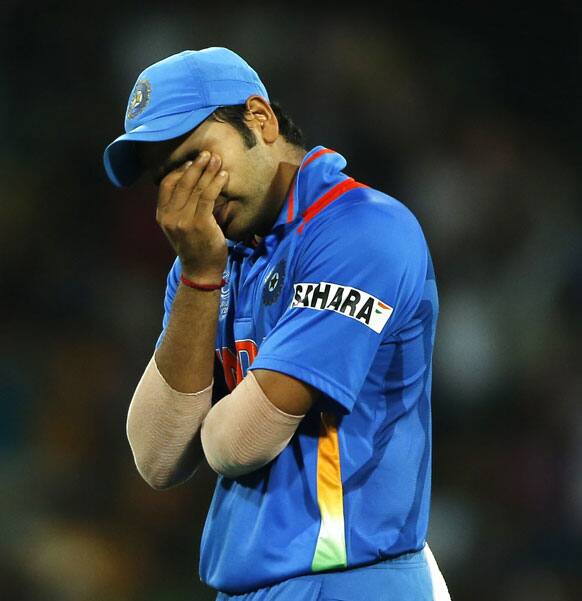 India's Rohit Sharma reacts as his team disqualify to reach semi finals during their ICC Twenty20 Cricket World Cup Super Eight match between India and South Africa in Colombo.