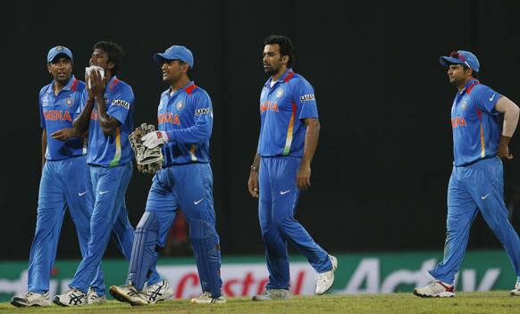 India's cricketers from left Ravichandran Ashwin, Lakshmipathi Balaji, captain Mahendra Singh Dhoni, Zaheer Khan and Suresh Raina walk back to the pavilion after the ICC Twenty20 Cricket World Cup Super Eight match between India and South Africa in Colombo.