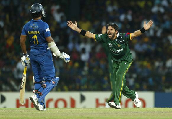 Shahd Afridi unsuccessfully appeals for the wicket of Sri Lankan batsman Jeevan Mendis, unseen, as non striker Kumar Sangakkara looks on during the ICC Twenty20 Cricket World Cup semi final match.