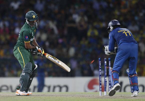 Sri Lanka's wicket keeper Kumar Sangakkara, right successfully stumps Pakistan's Sohail Tanvir, left during the ICC Twenty20 Cricket World Cup semifinal match between Sri Lanka and Pakistan in Colombo.