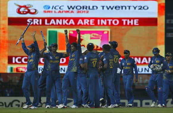 Sri Lanka's cricketers celebrate after beating Pakistan during the ICC Twenty20 Cricket World Cup semifinal match in Colombo.