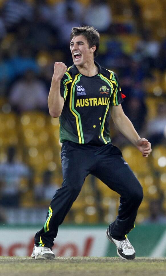 Australia's bowler Pat Cummins celebrates after taking the wicket of West Indies' batsman Marlon Samuels, not seen, during the ICC Twenty20 Cricket World Cup semifinal match in Colombo.