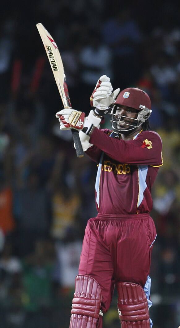 West Indies's batsman Chris Gayle celebrate scoring a half-century during the ICC Twenty20 Cricket World Cup semifinal match between Australia and West Indies in Colombo.