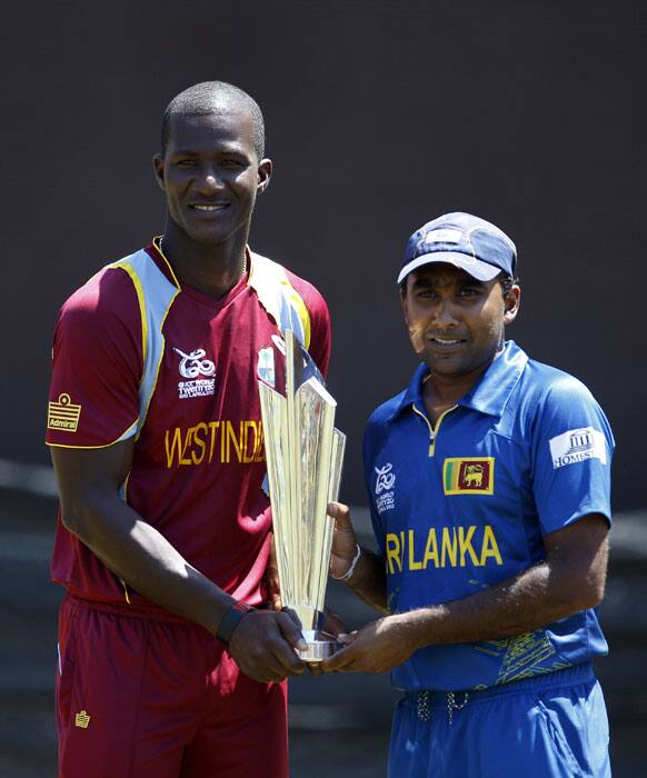 Captains, Darren Sammy, left, of West Indies and Mahela Jayawardene of Sri Lanka, pose with the winner's trophy of the ICC Twenty20 Cricket World Cup ahead of their final match in Colombo.