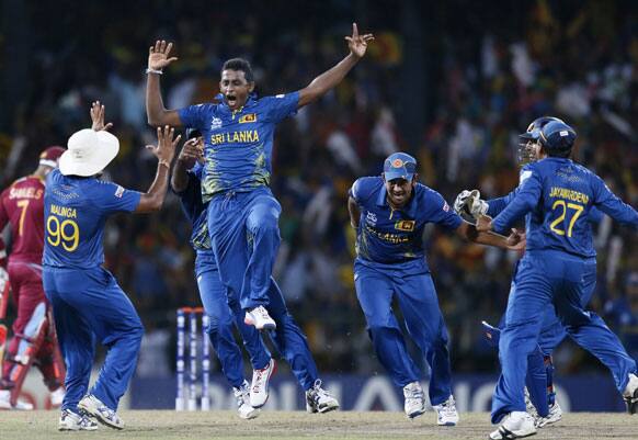 Sri Lanka's bowler Ajantha Mendis, second left facing, celebrates the dismissal of West Indies's batsman Chris Gayle, unseen, during the ICC Twenty20 Cricket World Cup final match in Colombo.